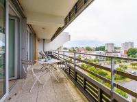 a balcony with a table and chairs and a view of a city at Apartment Rivadour 2 by Interhome in Bayonne