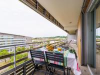 a balcony with a table and chairs on a balcony at Apartment Rivadour 2 by Interhome in Bayonne