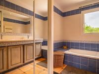a bathroom with a tub and a sink at Holiday Home La Bastide by Interhome in Tourves