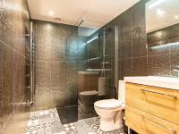 a bathroom with a toilet and a sink and a shower at Holiday Home La Bastide by Interhome in Tourves