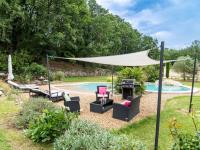 a patio with chairs and a canopy next to a pool at Holiday Home La Bastide by Interhome in Tourves
