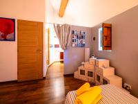 a bedroom with a bed and a pile of boxes at Holiday Home Le Mas d&#39;Adélaïs by Interhome in Baron