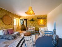 a living room with couches and a table at Holiday Home Le Mas d&#39;Adélaïs by Interhome in Baron