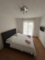 Posteľ alebo postele v izbe v ubytovaní Apartmani Peco Duće
