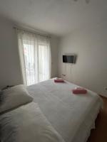 Posteľ alebo postele v izbe v ubytovaní Apartmani Peco Duće