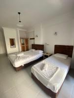 Postel nebo postele na pokoji v ubytování AY OTEL 2