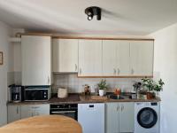 a kitchen with white cabinets and a counter top at Appartement Suhalmendi in Sare
