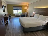 a hotel room with a bed and a desk at Holiday Inn Express Hotel & Suites San Dimas by IHG in San Dimas