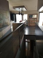 a kitchen with a black counter top in a room at Villa 10 p.Brando 170 m2 vue mer panoramique in Brando