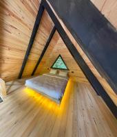 A bed or beds in a room at Ayder Çalıkuşu Bungalov