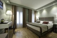 A bed or beds in a room at Hotel Forte del 48