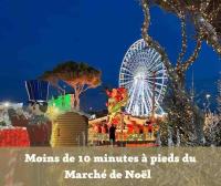 a carnival with a ferris wheel at night at BARCABEACH front de mer avec terrasse et parking in Le Barcarès