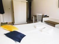 A bed or beds in a room at Oasi Park Hotel