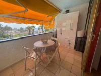 A balcony or terrace at Apartamento con piscina climatizada y vista al mar