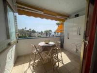 A balcony or terrace at Apartamento con piscina climatizada y vista al mar