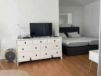A bed or beds in a room at Apartamento con piscina climatizada y vista al mar