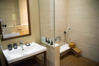 a bathroom with a sink and a shower at Beitou Sweet Me Hot Spring Resort in Taipei
