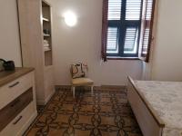 Postel nebo postele na pokoji v ubytování CASA VERDINA, nel cuore di Alghero