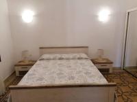 Postel nebo postele na pokoji v ubytování CASA VERDINA, nel cuore di Alghero
