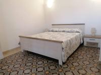 Postel nebo postele na pokoji v ubytování CASA VERDINA, nel cuore di Alghero