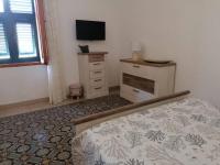 TV a/nebo společenská místnost v ubytování CASA VERDINA, nel cuore di Alghero