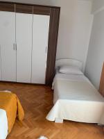 Posteľ alebo postele v izbe v ubytovaní Roman Forum Apartments