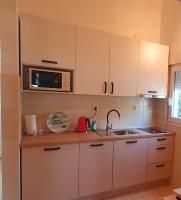 Kuchyň nebo kuchyňský kout v ubytování Apartments Rotim