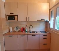 Kuchyň nebo kuchyňský kout v ubytování Apartments Rotim
