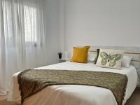 Postel nebo postele na pokoji v ubytování Tajues Apartment