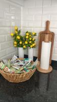 a basket filled with magazines and a vase with lemons at Serenity Apart in Antalya