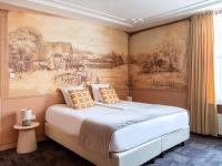 Ein Bett oder Betten in einem Zimmer der Unterkunft 't Hotel