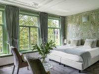 Ein Bett oder Betten in einem Zimmer der Unterkunft 't Hotel