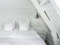 Ein Bett oder Betten in einem Zimmer der Unterkunft 't Hotel
