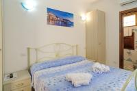 Posteľ alebo postele v izbe v ubytovaní Hotel La Marina