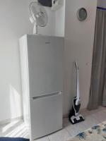 a white refrigerator with a fan on top of it at Apartment Gordana in Trogir