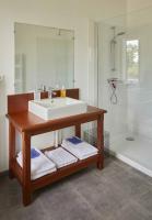 a bathroom with a sink and a shower and a tub at La Maison de Charlotte in Doudeville
