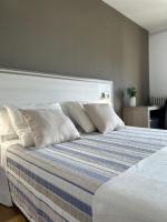 Postel nebo postele na pokoji v ubytování Hotel Planas
