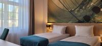 Łóżko lub łóżka w pokoju w obiekcie Hotel Eureka