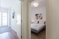 Postel nebo postele na pokoji v ubytování FLH Penha França Art Apartment