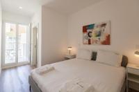 Postel nebo postele na pokoji v ubytování FLH Penha França Art Apartment