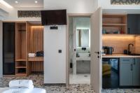 a kitchen with a sliding door leading to a sink at NERO SEASCAPE SUITES in Fanari
