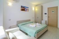 Posteľ alebo postele v izbe v ubytovaní Hotel La Marina