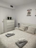 Postel nebo postele na pokoji v ubytování Jardines Apartment