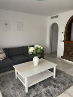 Posezení v ubytování Jardines Apartment