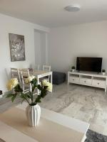 TV a/nebo společenská místnost v ubytování Jardines Apartment