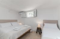 A bed or beds in a room at Masseria Bel Cortile - Ostuni