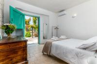 A bed or beds in a room at Masseria Bel Cortile - Ostuni