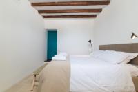 A bed or beds in a room at Masseria Bel Cortile - Ostuni