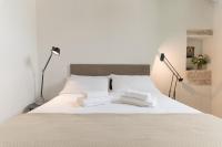 A bed or beds in a room at Masseria Bel Cortile - Ostuni