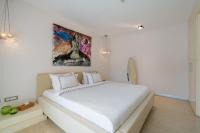 A bed or beds in a room at Casa dell'Arte Hotel of Arts & Leisure